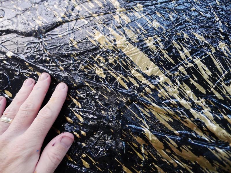 black and gold abstract painting